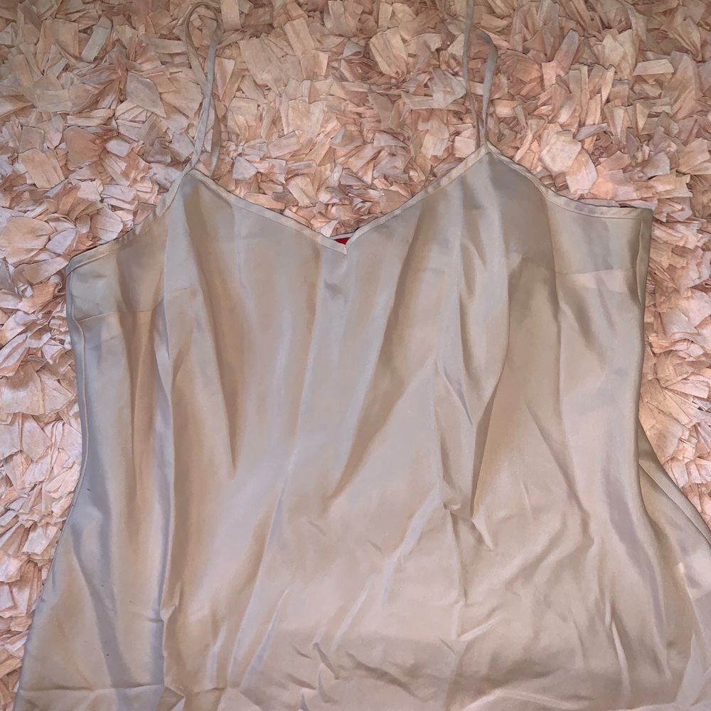 Cream/tan colored tank top.